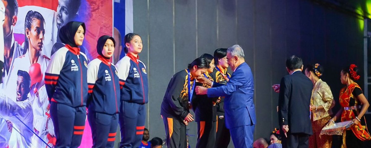 With grace and jubilation, Tun Mohd. Ali Mohd. Rustam bestowed the gleaming bronze medals upon the triumphant trio, Anak Yampil, Lovelly Anne, and Rojin, who emerged victorious in the fiercely contested Senior Kata Team Female Bronze Medal match.
